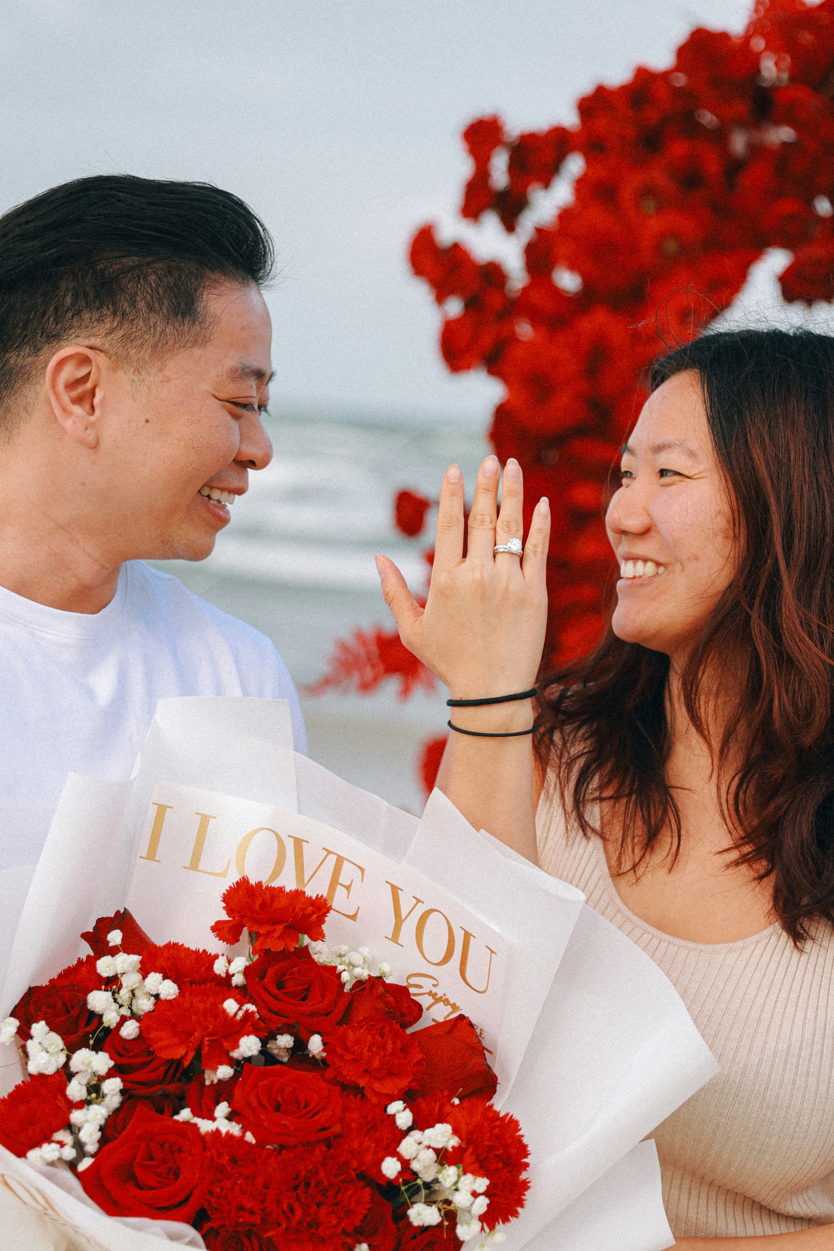 Couple at beach proposal
